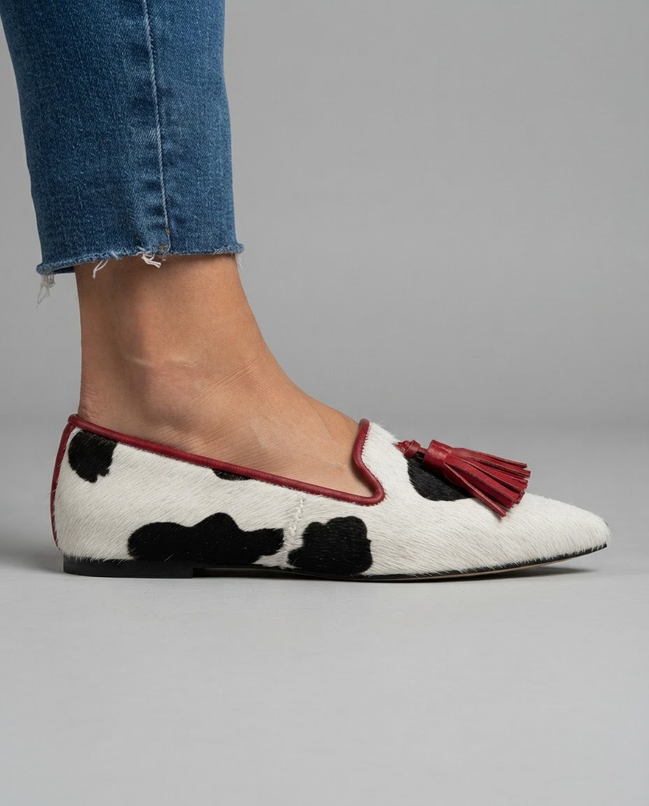 Ginevra™ | Black and White Cow Print Moccasin with Red Tassels