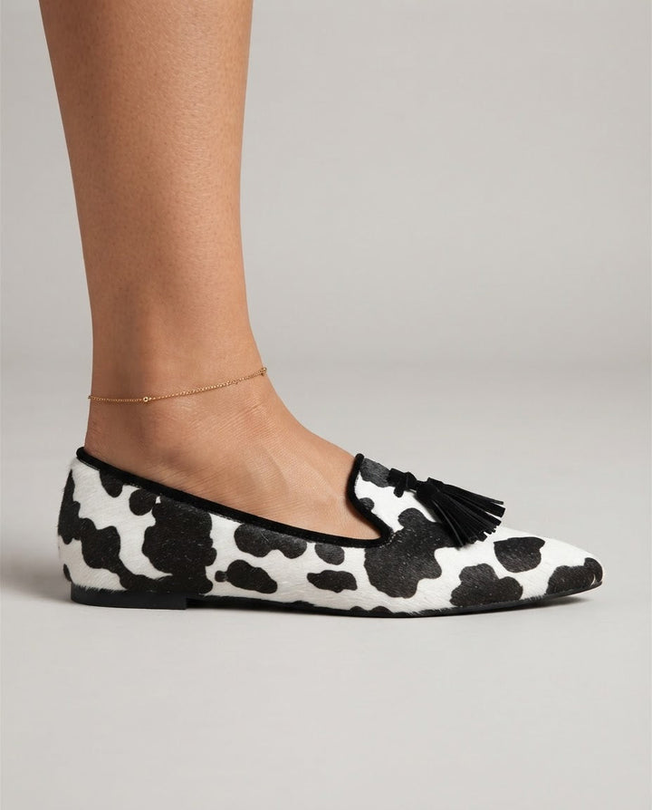 Ginevra™ | Black and White Cow Print Moccasin with Black Tassels