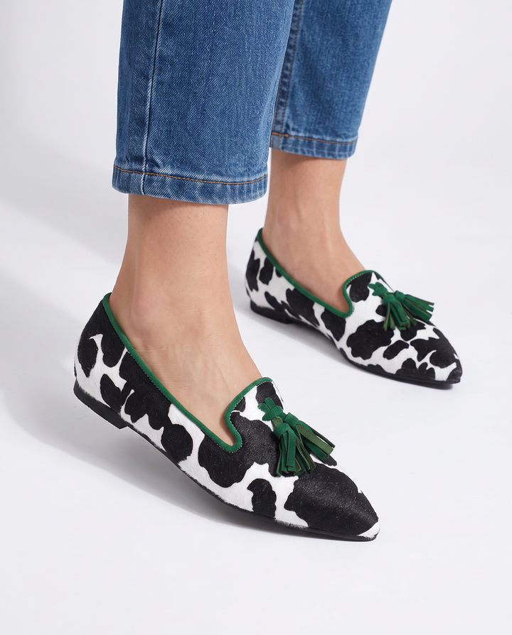 Ginevra™ | Black and White Cow Print Moccasin with Green Tassels