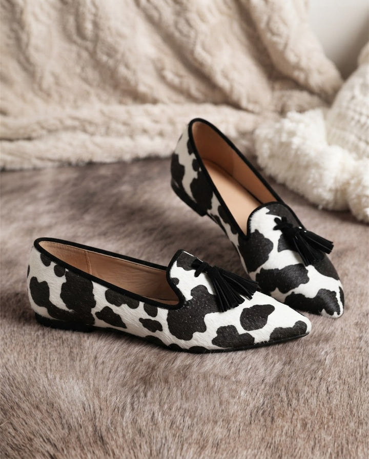 Ginevra™ | Black and White Cow Print Moccasin with Black Tassels