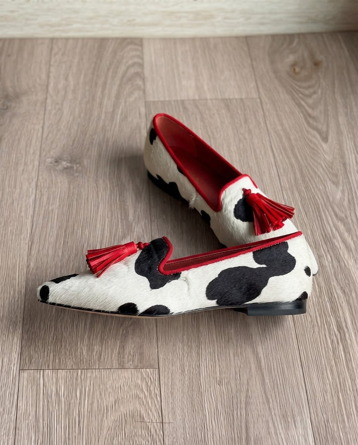 Ginevra™ | Black and White Cow Print Moccasin with Red Tassels