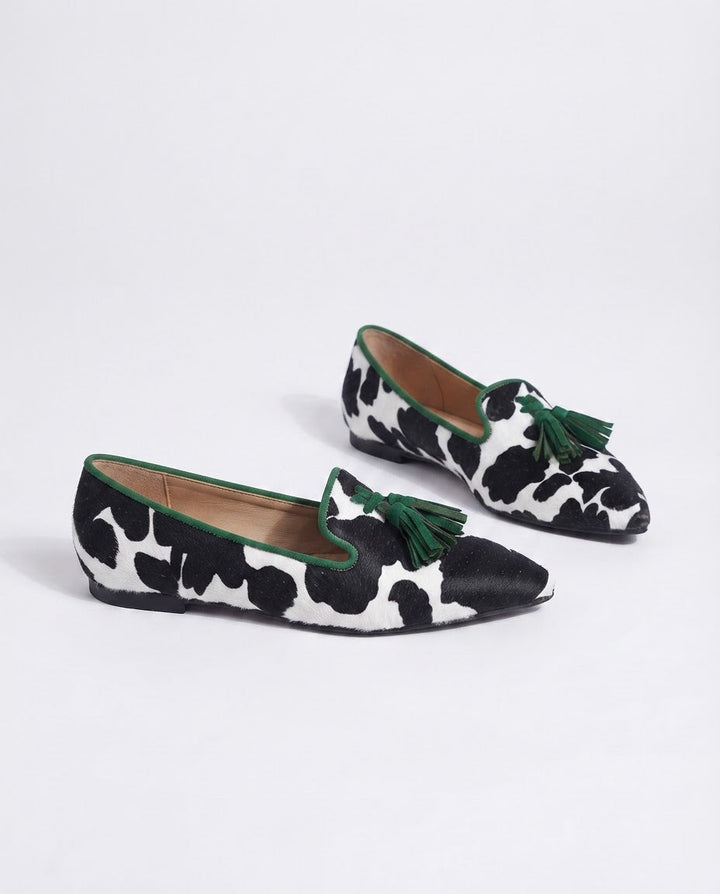 Ginevra™ | Black and White Cow Print Moccasin with Green Tassels